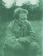 Poet Edward Thomas kneeling down.